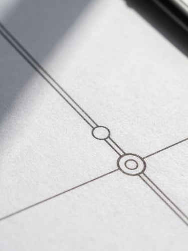 Macro crop of a physical system schematic, sharp black lines on crisp white paper, direct high-contrast daylight casting sharp shadows.