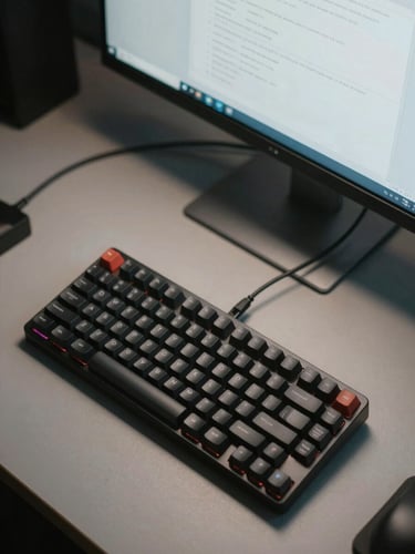 Top-down view of a minimalist workspace, single mechanical keyboard, organized cables, clean terminal window on a monitor, cool-toned lighting.