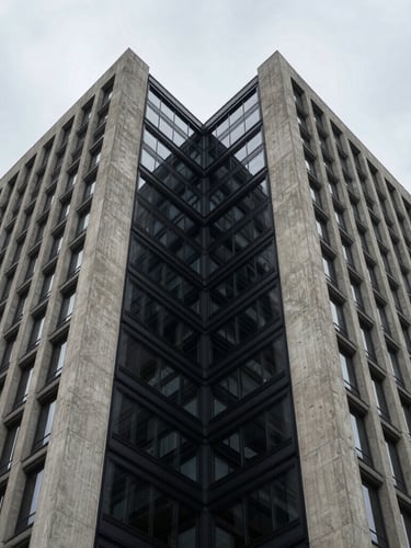 Symmetrical architectural crop of a modern concrete and steel financial headquarters, deep shadows, sharp geometric lines, overcast daylight.