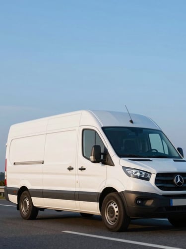 Low-angle tracking shot of a modern white refrigerated transport van driving on a Dutch highway during crisp morning blue hour, sharp focus, professional commercial photography