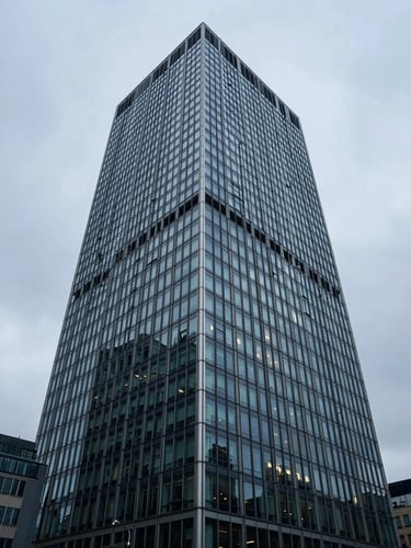 Wide-angle architectural detail of a modern glass and steel financial tower in London under cool overcast daylight, sharp focus, 35mm lens