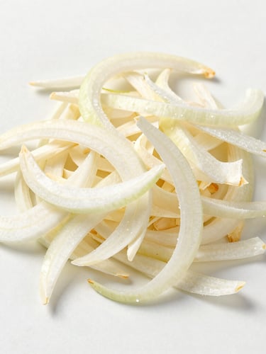 Top-down macro shot of premium dehydrated white onion flakes on a clean off-white surface under bright studio lighting, emphasizing purity and texture.