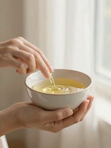 Hands holding a warm ceramic bowl with cosmetic oil, soft morning light, portrait aspect
