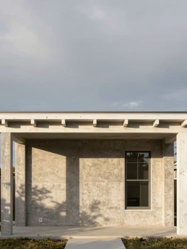 Straight-on architectural elevation of a concrete and white oak residential pavilion, dramatic golden hour shadows, soft overcast Michigan sky, editorial architectural photography