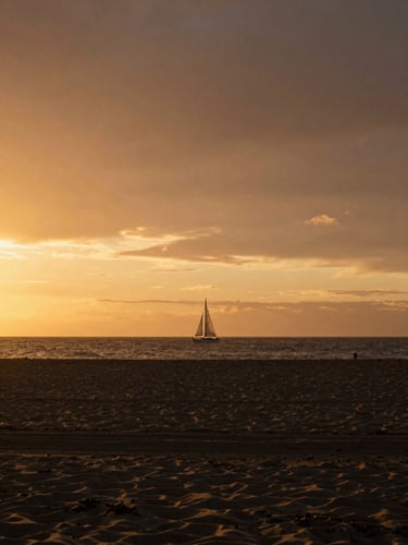 A quiet, atmospheric sunset over an empty beach, a single sailboat on the horizon, soft golden light, cinematic editorial