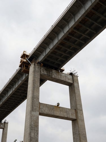 Low-angle heroic shot of a massive concrete bridge under construction, dramatic overcast sky, high-contrast