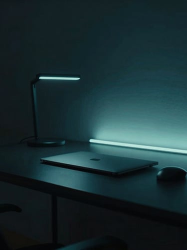 Cinematic side-lit shot of a minimalist workspace in Portugal, sleek hardware on an obsidian desk, cool teal ambient glow