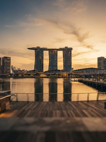 Symmetrical architectural view of Singapore Marina Bay skyline at golden hour, clean lines, shallow depth of field, warm editorial photography style