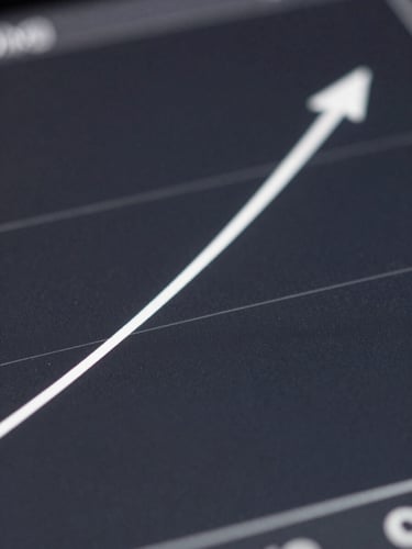 Macro close-up of a high-contrast search console growth curve on a dark screen, crisp white lines on deep charcoal background