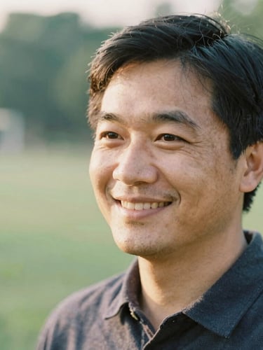 Candid close-up of a professional specialized educator smiling, soft natural golden-hour lighting, outdoor green background, 35mm film look