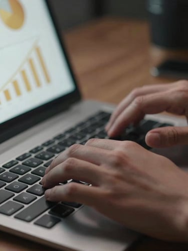 Macro close-up of a modern workspace, hands typing on a sleek keyboard, a tablet displaying analytics charts with gold highlights nearby, dramatic low-key lighting