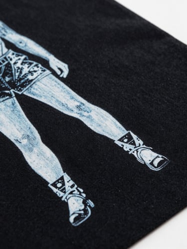 Close-up of high-fidelity screen printing on heavy black cotton fabric, crisp white ink details, cool overcast studio lighting, premium editorial fashion photography