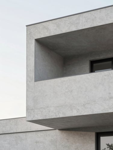 A minimalist architectural detail of a modern home facade, clean concrete angles, soft natural daylight, muted cool tones, 35mm