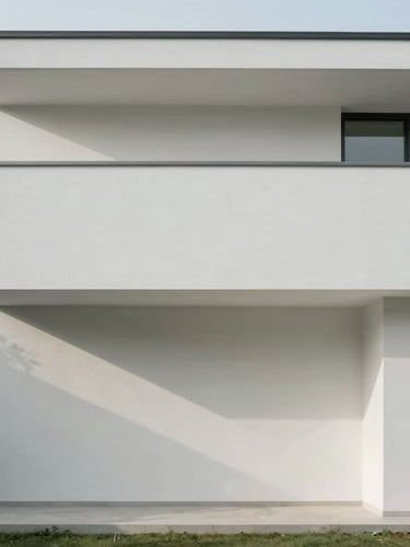 Minimalist modern home exterior, clean architectural lines, soft natural daylight, muted cool tones, 35mm photography