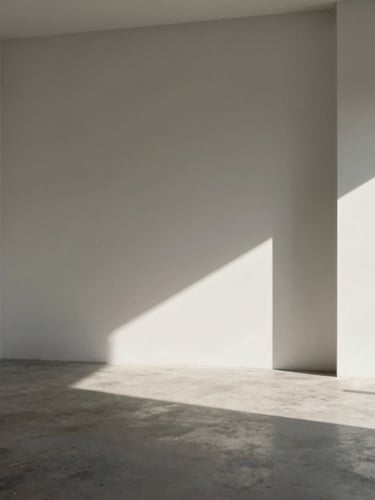 Minimalist sunlit photo studio with high-contrast architectural shadows, concrete floor, white walls, empty space, warm gray tones
