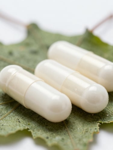 Extreme macro close-up of pristine white unbranded capsules resting on dry green herbal leaves, sterile clinical white light.