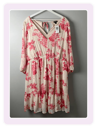 Torrid floral print long-sleeve mini dress with pink roses and Swiss dot texture on a cream fabric.