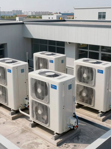 Wide environmental shot of a modern commercial HVAC system on a building roof, clean lines, bright daylight, technical and orderly layout.