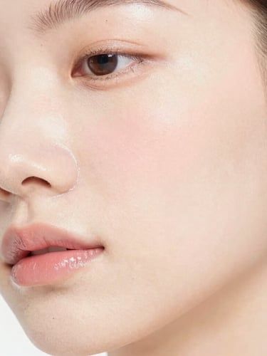 Bright high-key clinical photography, macro shot of glowing healthy skin with soft blush tones and crisp studio lighting, absolute purity.