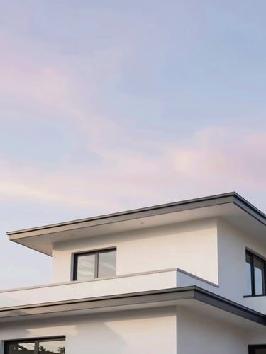 Bright architectural photo of a clean modern home roofline under a pastel sky, soft natural daylight, 35mm
