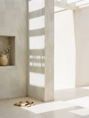 Bright minimalist architectural corner, sharp concrete lines casting geometric shadows under clean natural daylight, soft warm sand tones, 35mm lens