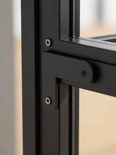 extreme close-up of premium black anodized aluminum frame hardware, precise lock mechanism, matte finish, architectural luxury detailing, sharp focus.