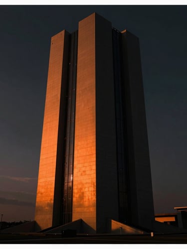 Cinematic digital concept art frame, dark moody atmosphere with sharp orange chiaroscuro lighting on a futuristic architectural monolith, wide aspect ratio