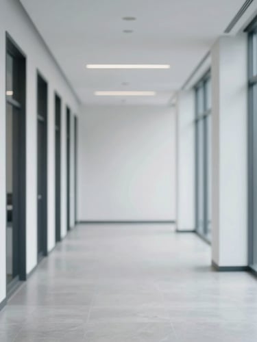 Architectural interior of a modern, clean office space in Ajax, Ontario, with subtle branding, soft natural daylight, cool undertones, clean lines, shallow depth of field, 35mm, positioned to the right.