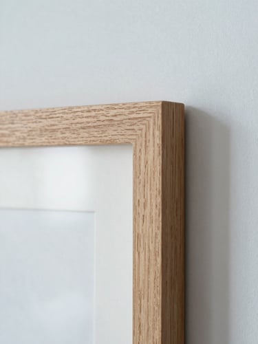 Close-up macro shot of a minimalist natural oak frame corner, soft north-facing daylight, clean shadows, shallow depth of field, 35mm