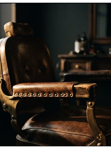 Dramatic close-up of a luxury leather salon chair, warm golden-hour side light, deep charcoal shadows, cinematic 35mm photography