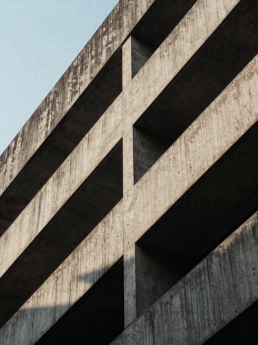 Cinematic architectural photograph of brutalist concrete building in Ho Chi Minh City, sharp diagonal shadows, high contrast sunlight, 35mm film grain, negative space on left
