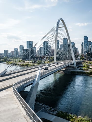 Crisp bright daylight architectural shot of a modern concrete and steel bridge spanning a clean river, high contrast, deep navy shadows, elegant corporate photography style