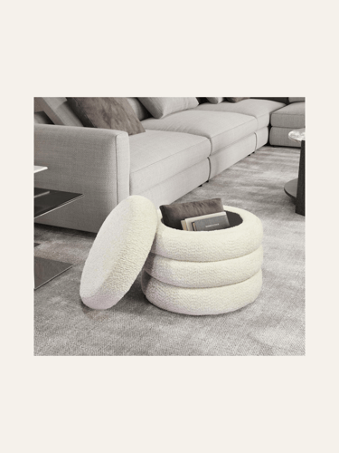 picture of a white boucle ottoman with top resting on the side