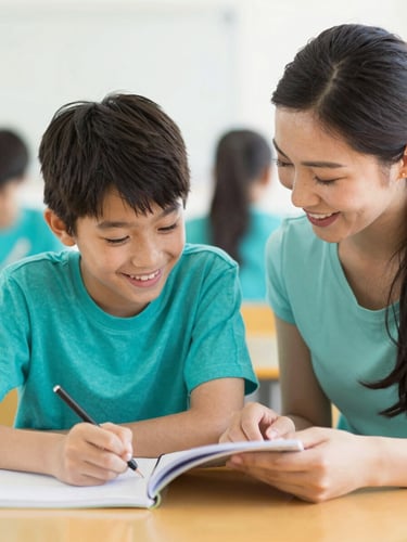 Candid medium shot of a supportive tutor and a young student laughing together over a notebook, warm daylight, soft teal accents, shallow depth of field