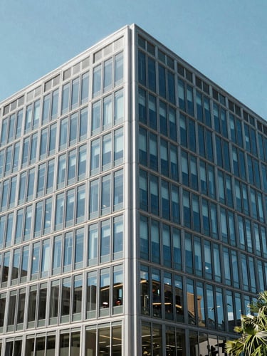Cool editorial photography, bright daylight, modern Austin office glass facade, sharp angles, 35mm