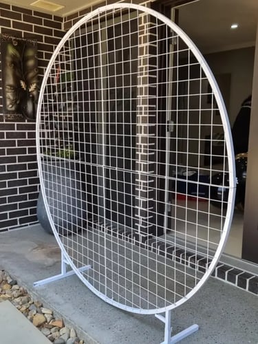 Cirlce mesh backdrop ready for it balloon garland for Grace's 18th birthday in Logan.
