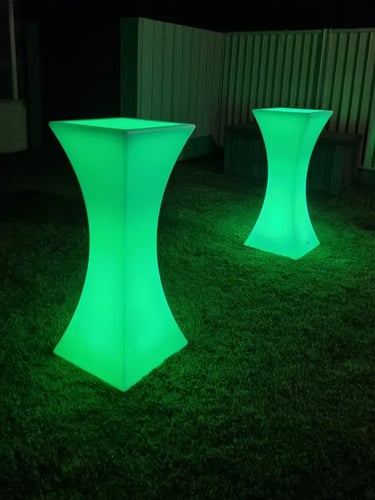 Green glow cocktail tables in the backyard of a halloween event in Gold Coast.