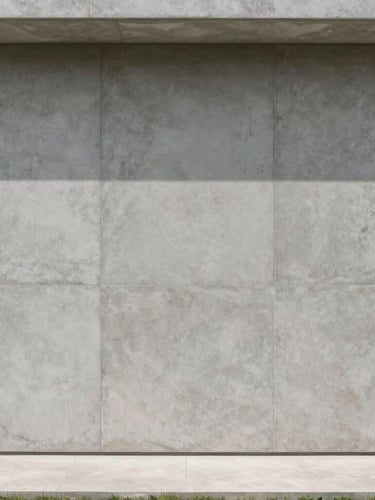 Straight-on architectural elevation of a minimalist luxury residence interior in Condominio Peninsula, showcasing a large feature wall with flawless gray burnt concrete texture under soft, natural daylight.