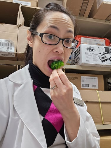 Pharmacist Linda eating broccoli