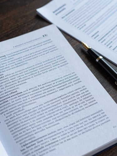 A close-up flat lay of a peer-reviewed scientific manuscript on a dark wooden desk, next to a classic fountain pen and structured research notes, shot in clean editorial style with soft natural daylight.