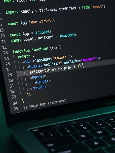 Macro shot of physical laptop screen displaying clean, syntax-highlighted React code, cool studio lighting with deep slate shadows and neon green glows, sharp focus, 35mm
