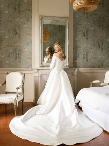 Bride getting ready in a château suite in Provence - Editorial wedding photo style