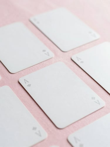 Close-up of elegant minimalist tarot cards laid out on a soft pink silk cloth, gentle morning light, clean aesthetic, negative space, 35mm fine-art photography