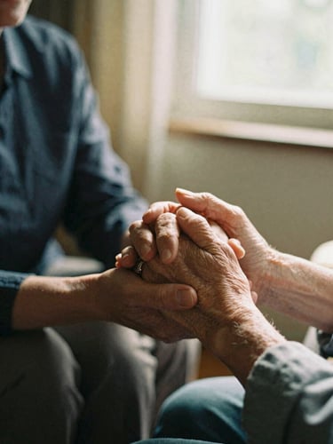 Medium close-up of a warm caregiver holding an older woman's hand in a sunlit room, soft natural window light, rich organic tones, shallow depth of field, 35mm film