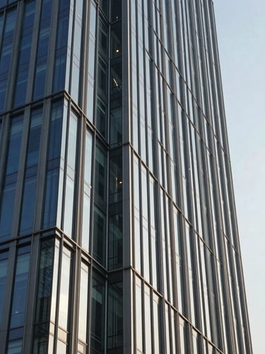 Architectural elevation of a modern steel and glass commercial tower in Gurugram under sharp morning light, clean corporate geometry.