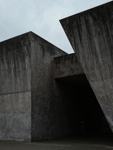 Overcast daylight view of stark architectural concrete geometry in London, deep shadows, high-contrast moody editorial photography, letterbox format.