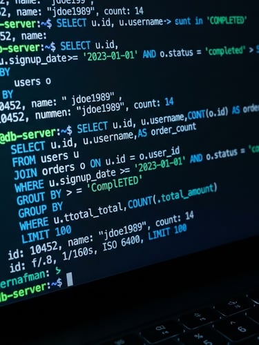 Sleek close-up of a dark-mode terminal screen displaying database queries, bright green and blue code lines, sharp focus, 35mm lens