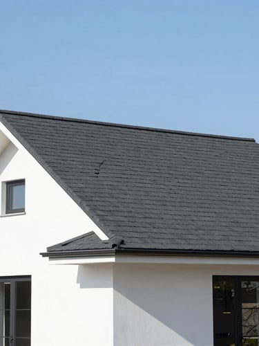 Bright architectural photography of a beautiful modern residential home with a newly installed dark charcoal shingle roof, clear daylight, high-end real estate style