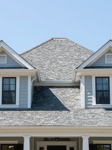 Bright architectural photo of a classic New Orleans residential home exterior showing a perfectly repaired slate-style shingle roof, clear daylight