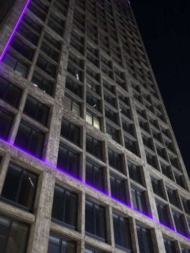 Wide dramatic architectural angle of a modern concrete and steel skyscraper facade under low-key dramatic night lighting, sharp purple laser lines tracing the structural grid.